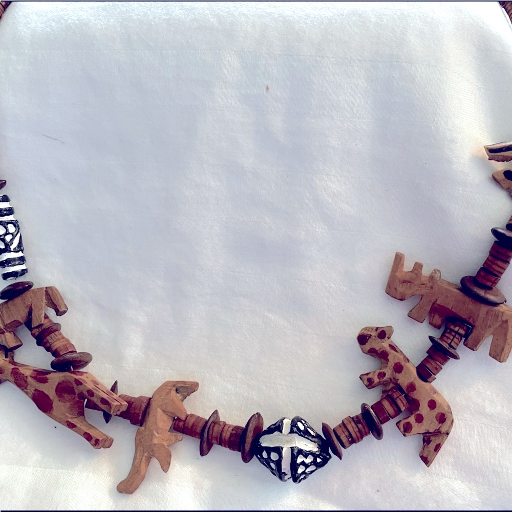 Vintage wooden carved animal necklace.